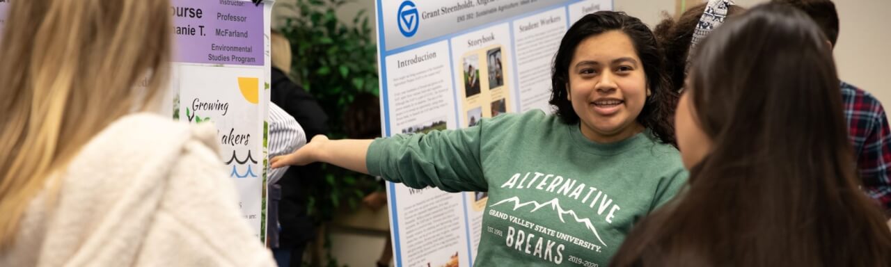 A student presents a project at a sustainability showcase